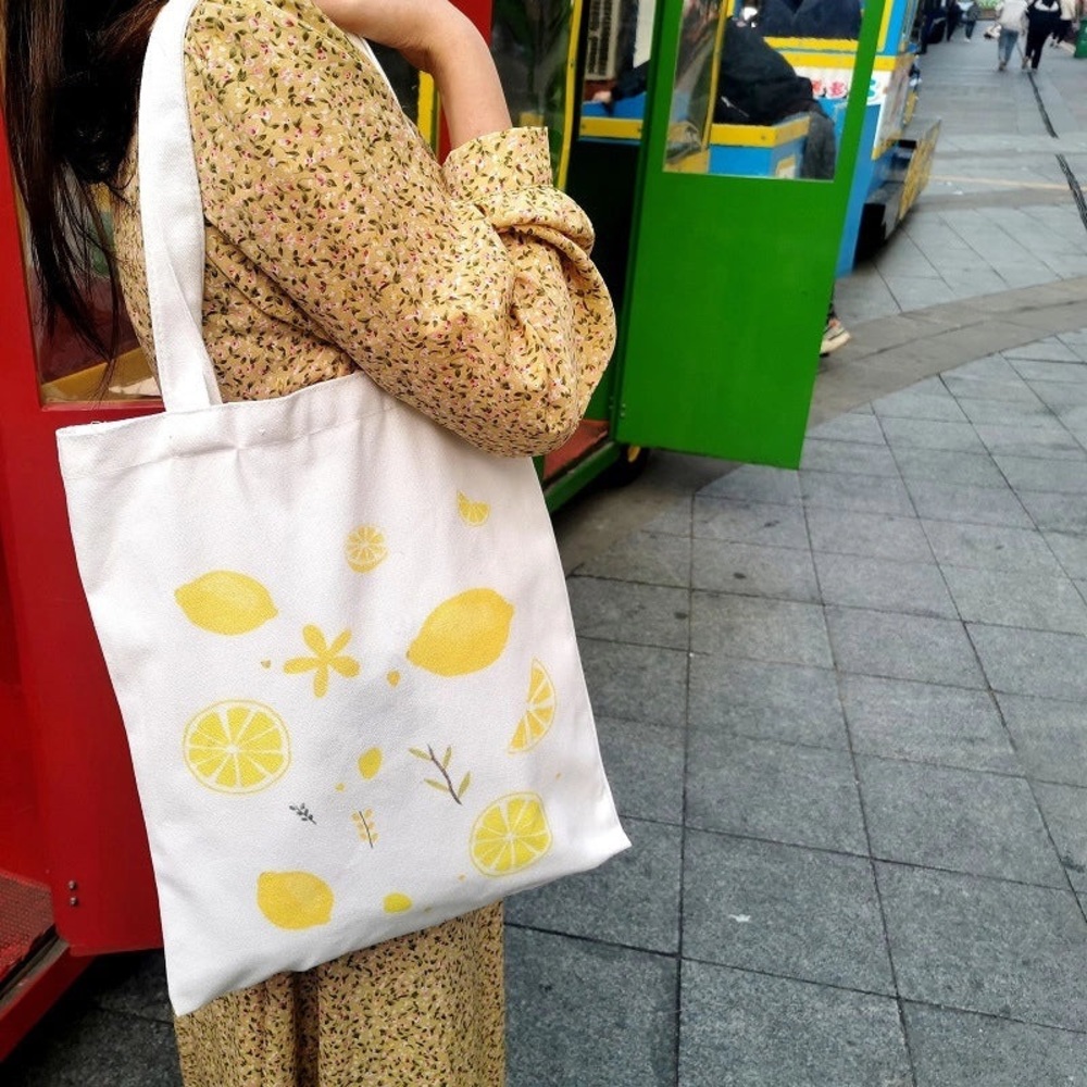 Stylish White Fruit Canvas Tote Bag with Yellow Accents